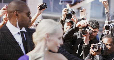 A group of people taking pictures of each … unsplash.com